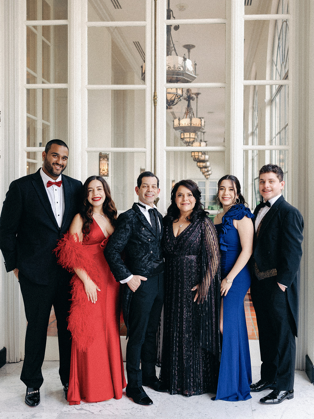 The Garza family in formal attire at a ballroom gala